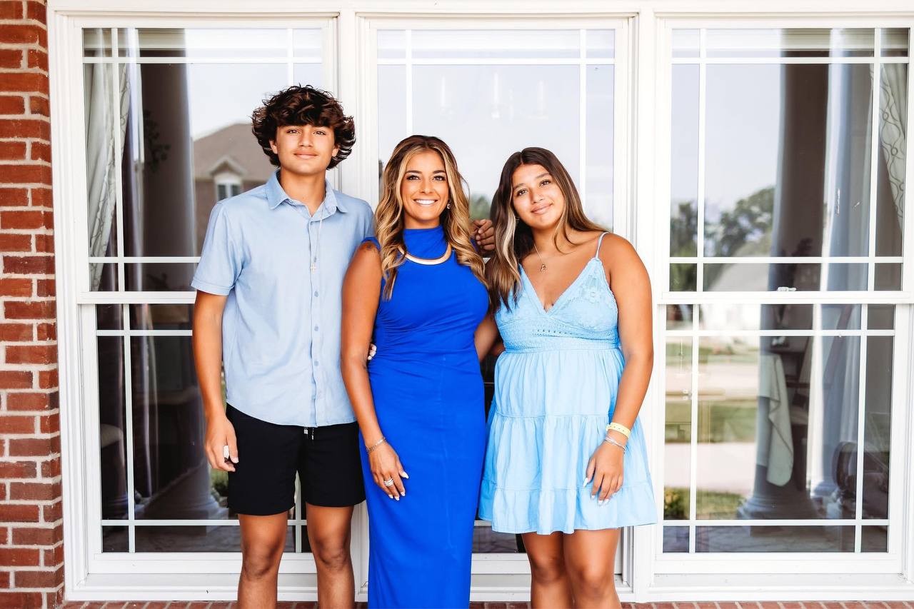 Naureen Stack-Frierdich standing with her two children